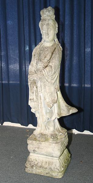 Appraisal: A cast stone garden figure of Kwan Yin on lotus