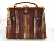 Appraisal: A large snakeskin handbag with brass fittings and faux buckle