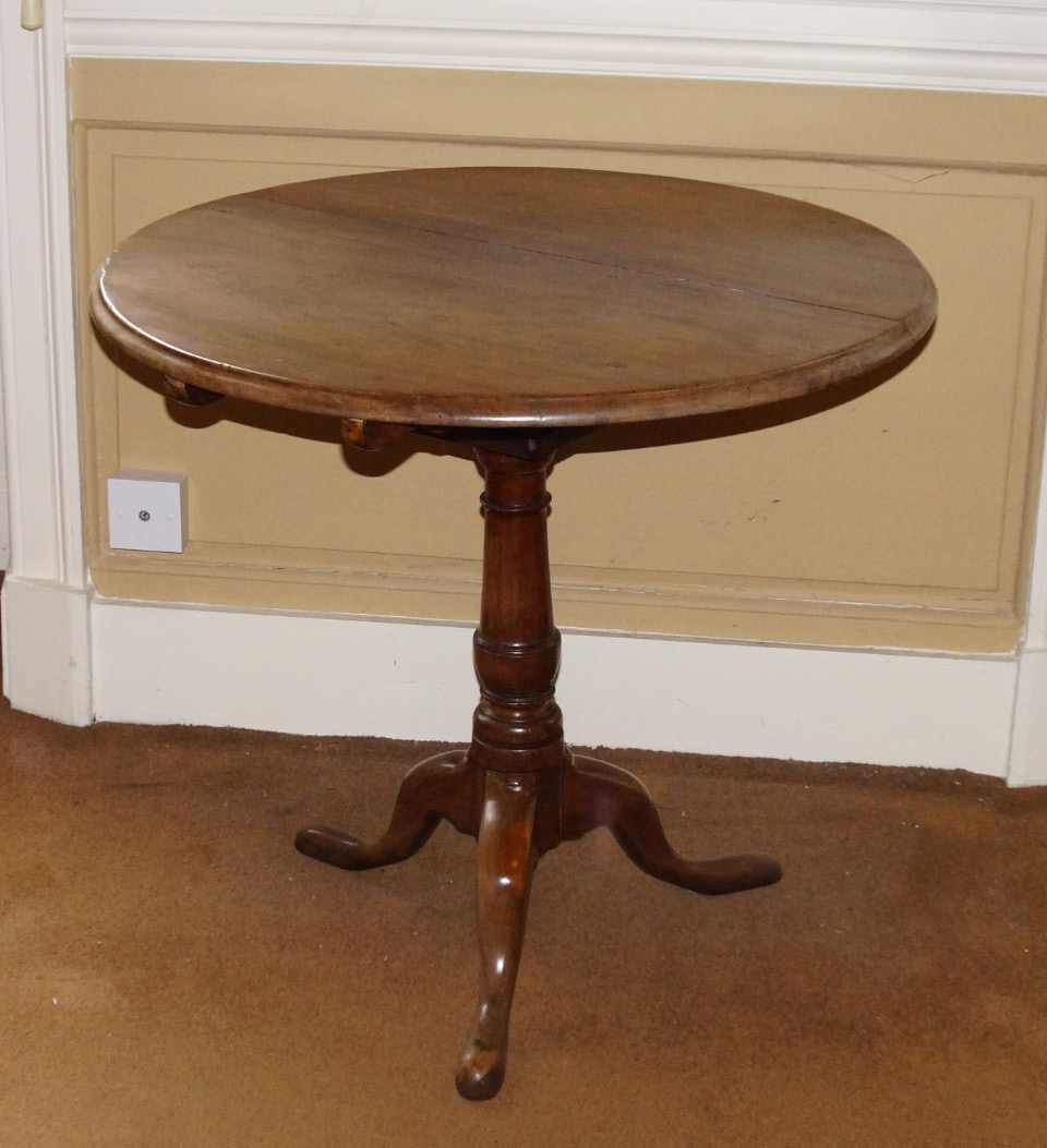 Appraisal: A thC mahogany tilt top occasional table the circular top