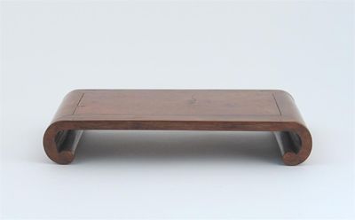 Appraisal: A Chinese hardwood stand with scrolling ends and an embroidered