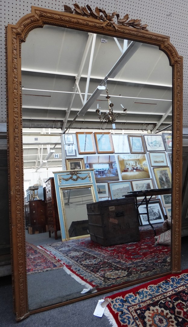 Appraisal: A large Victorian gilt framed arch top wall mirror cm