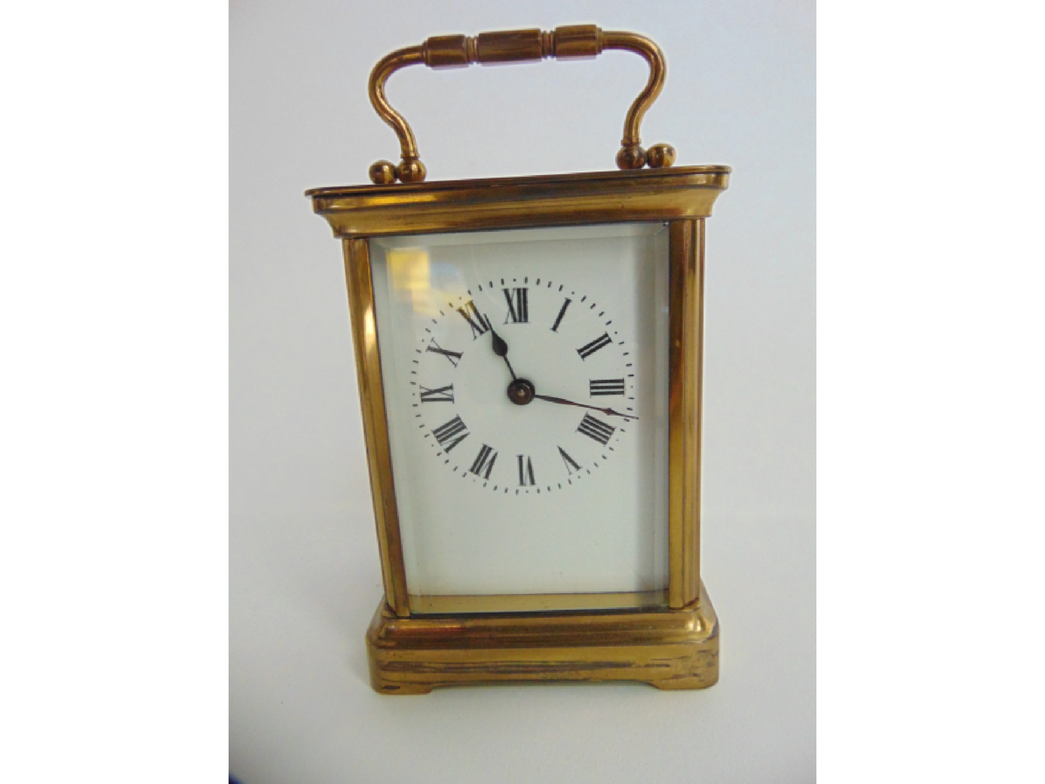 Appraisal: A brass carriage clock with enamelled dial and an eight