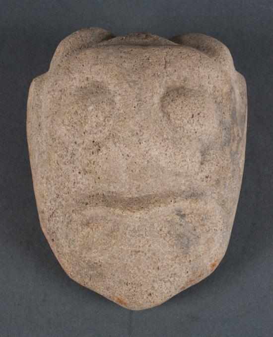 Appraisal: Chinese carved stone mask-pendant in the Chou manner portraying a