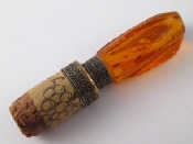 Appraisal: An amber mounted bottle stopper the amber about x x