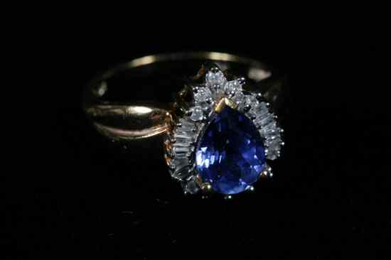 Appraisal: K YELLOW GOLD DIAMOND AND TANZANITE RING Pear shape tanzanite