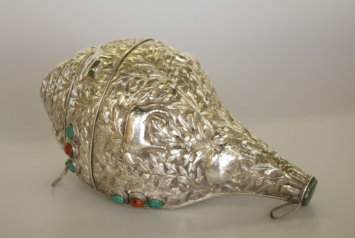 Appraisal: Tibetan Silver-Clad Conch Shell Trumpet or Dung-Dkar the shell entirely