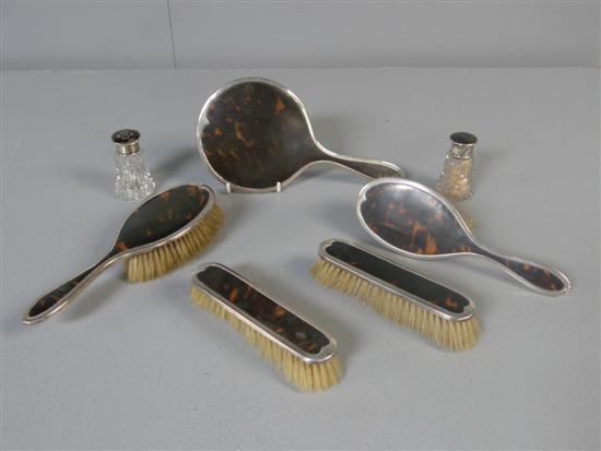 Appraisal: George V silver mounted and tortoiseshell backed dressing table set