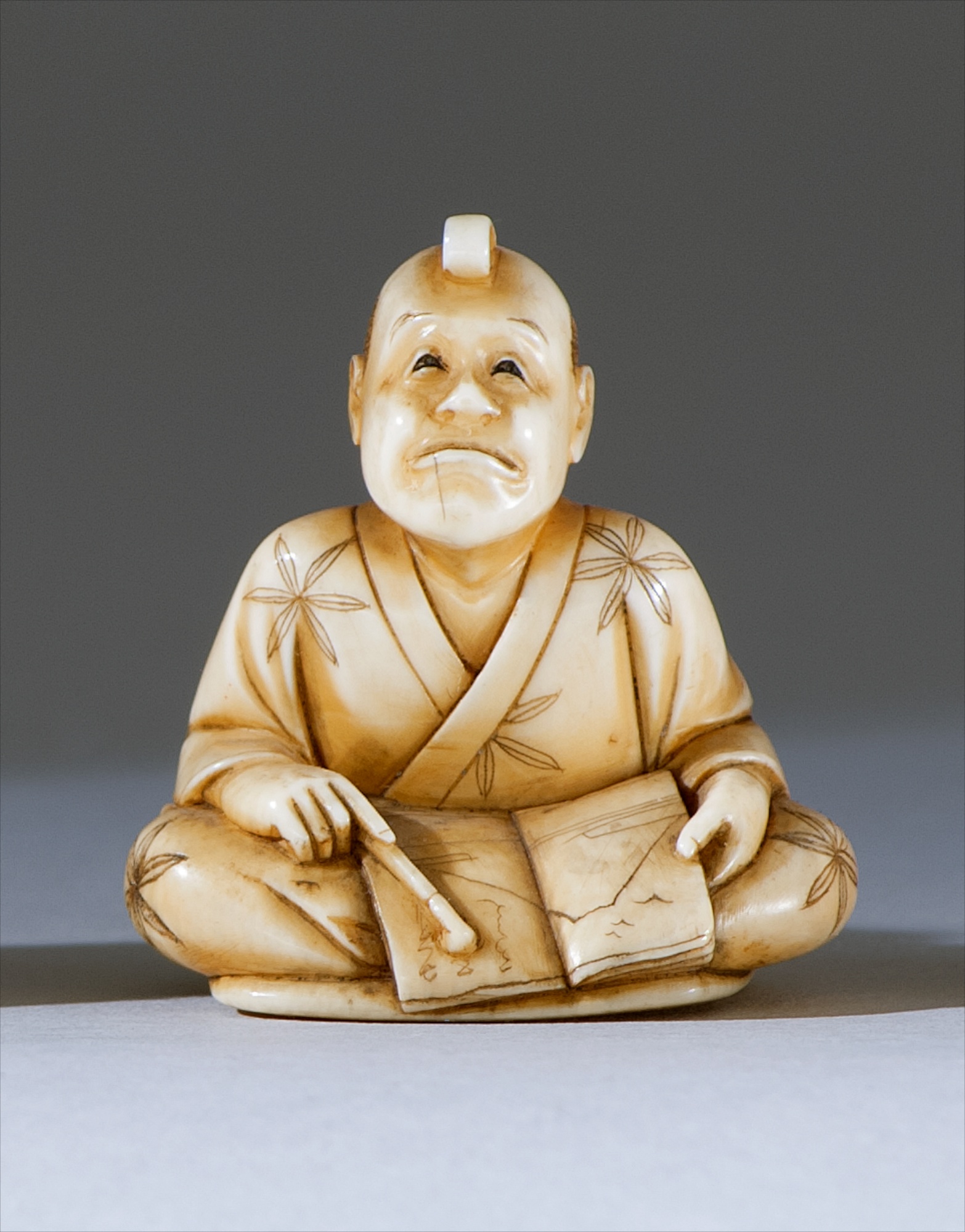 Appraisal: IVORY NETSUKE Late th CenturyBy Keimin Depicting a seated man