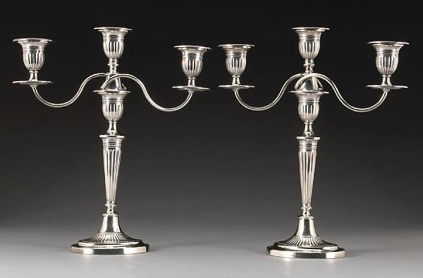 Appraisal: An Edward VII silver pair of candlesticks with three light