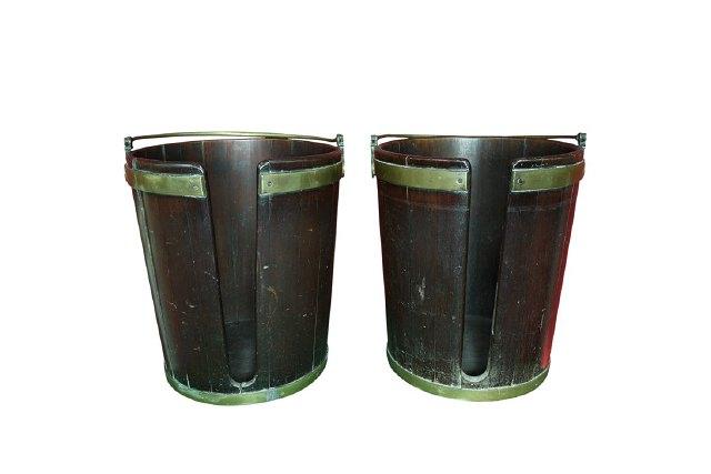 Appraisal: A pair of Irish mahogany plate buckets circa with brass