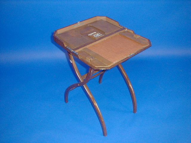 Appraisal: An Art Deco burr walnut finish folding writing table with