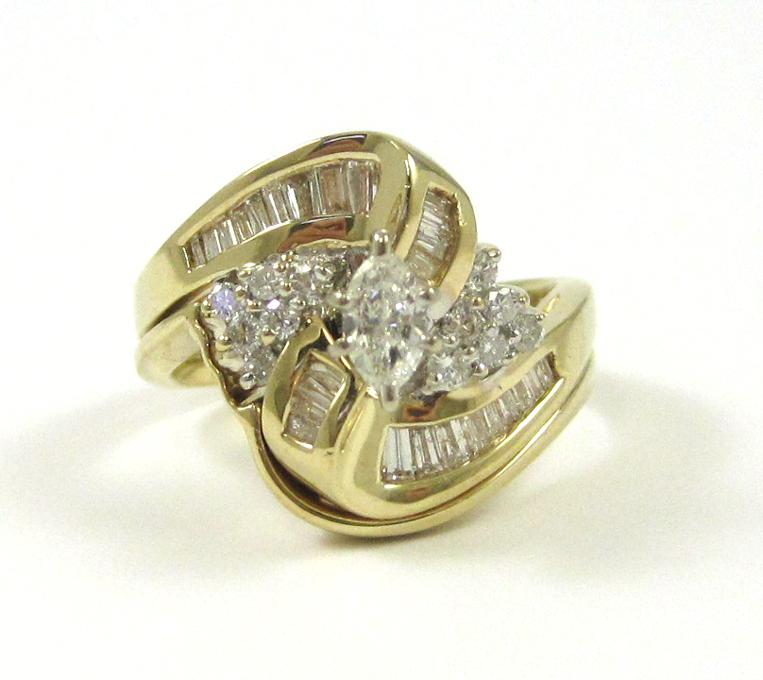 Appraisal: DIAMOND AND FOURTEEN KARAT GOLD RING with round-cut and baguette-cut