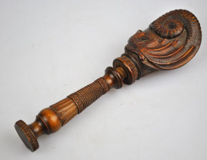 Appraisal: A late th century walnut nut cracker relief carved with