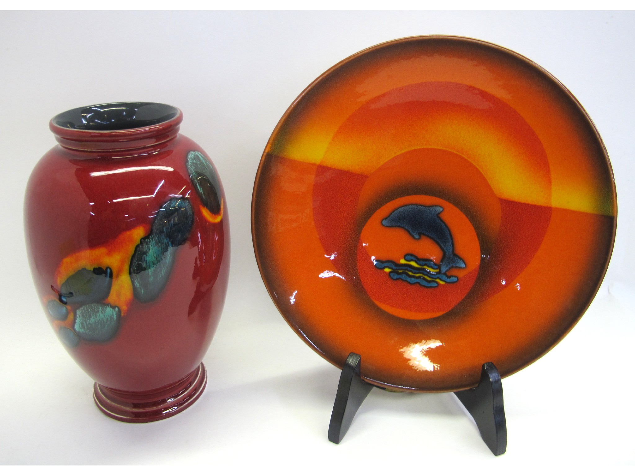 Appraisal: Poole pottery Dolphin plate and a flambe pottery vase