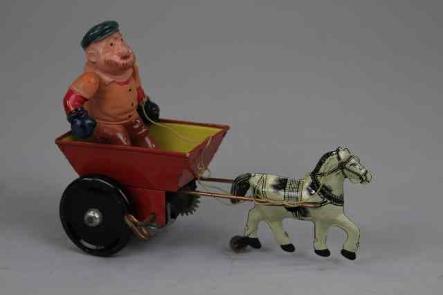 Appraisal: BRUTUS IN CART Marx tin litho with wind up action