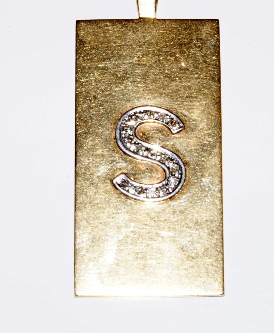 Appraisal: A ct gold ingot and chain bearing the initial 'S'