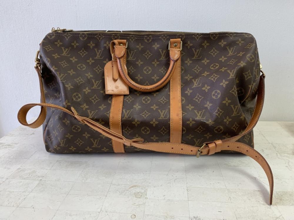 Appraisal: LOUIS VUITTON BROWN KEEPALL BANDOULIERE TRAVEL BAGLouis Vuitton brown Keepall