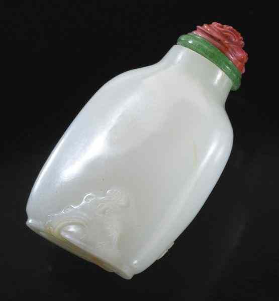 Appraisal: Chinese Qing carved white jade snuff bottle with coral stopper