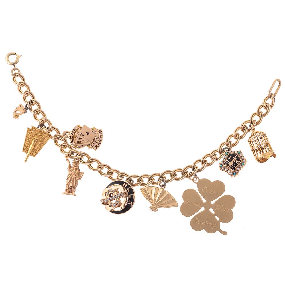 Appraisal: A K Charm Bracelet with Nine Charms in Gold K