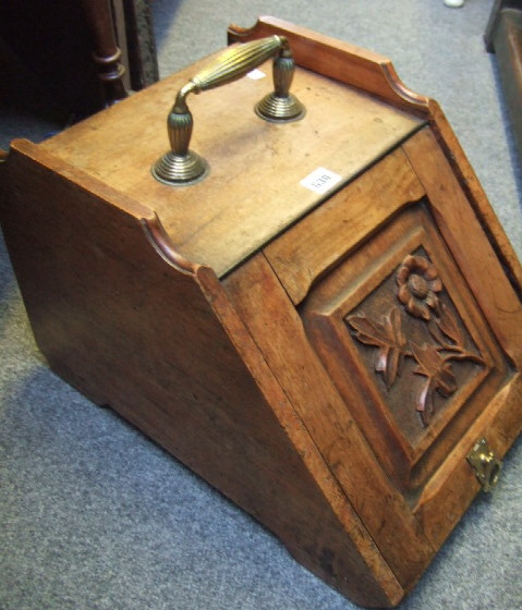 Appraisal: A carved oak coal purdonium a two tier occasional table