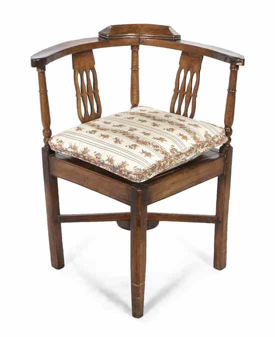 Appraisal: A Continental Fruitwood Corner Chair having a curved crest rail