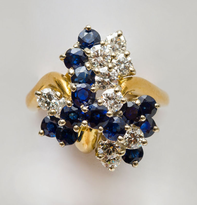 Appraisal: K GOLD DIAMOND AND SAPPHIRE COCKTAIL RING Set with round