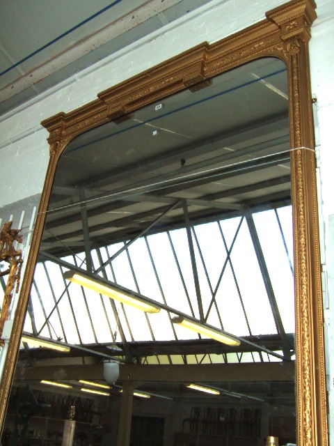 Appraisal: A large gilt framed wall mirror th century the break