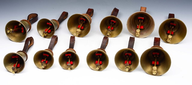 Appraisal: A GROUP OF TWELVE BRASS HAND BELLS ranging from 'C'