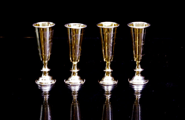 Appraisal: A set of four Russian silver and silver gilt toasting