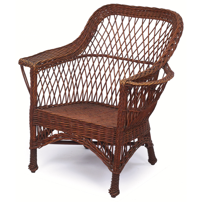 Appraisal: Wicker armchair original natural reed with book-holder at side w