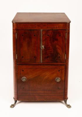 Appraisal: A Regency mahogany cabinet with ebonised stringing enclosed by a