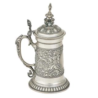 Appraisal: GERMAN SILVER TANKARD Adorned with beaded strap work cherubs and