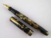 Appraisal: A Swan Mabie Todd fountain pen in mottled shades of