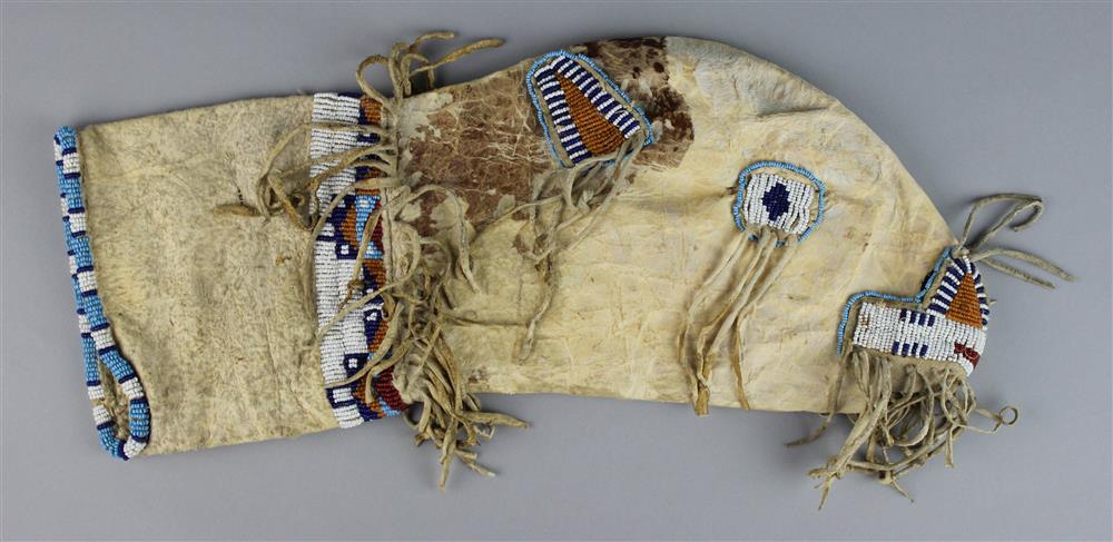 Appraisal: PLAINS BEADED AND FRINGED HIDE CALF'S-HEAD BAG length in Provenance