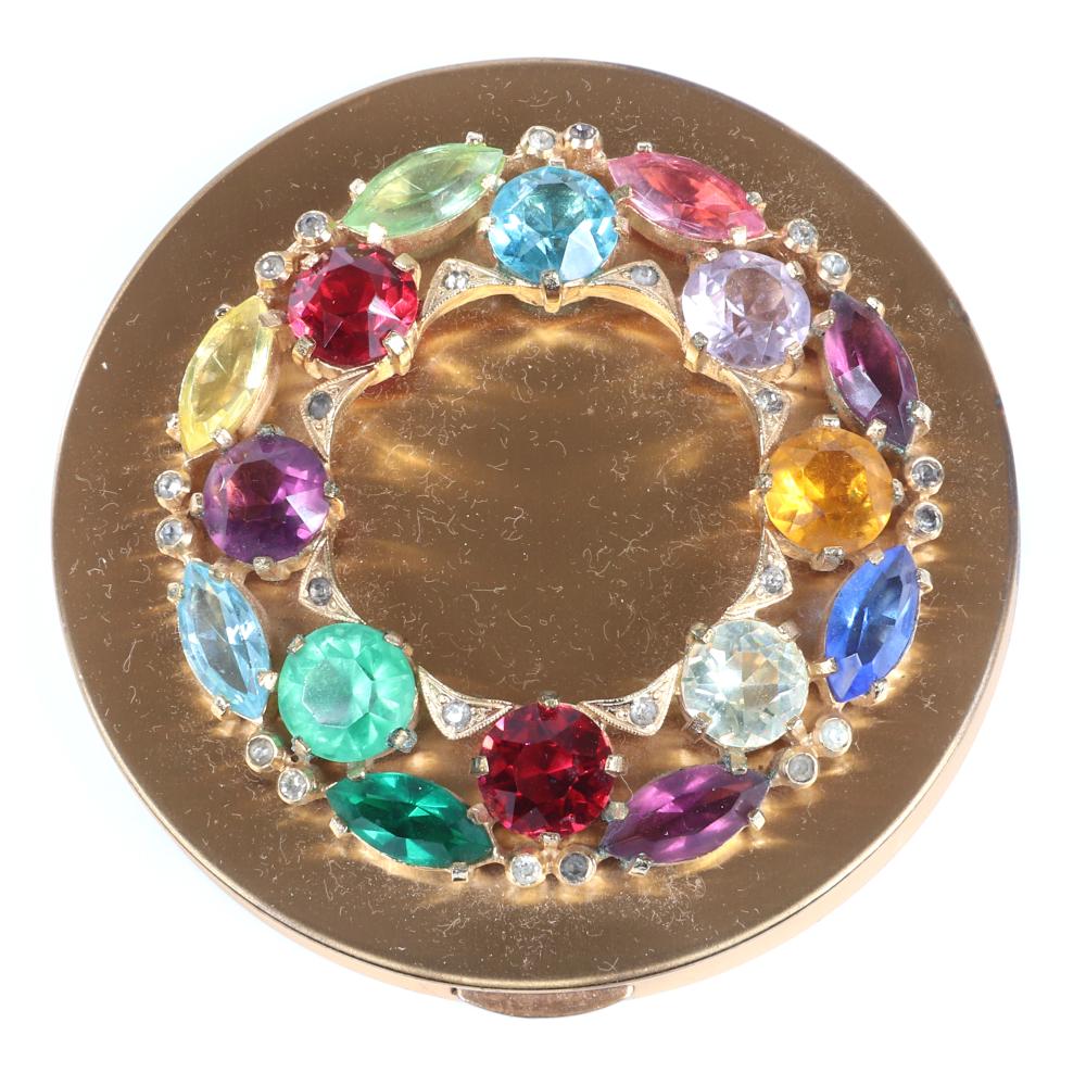 Appraisal: EISENBERG ORIGINAL COLORFUL ROUND COMPACT WITH POWDER PUFF AND INNER