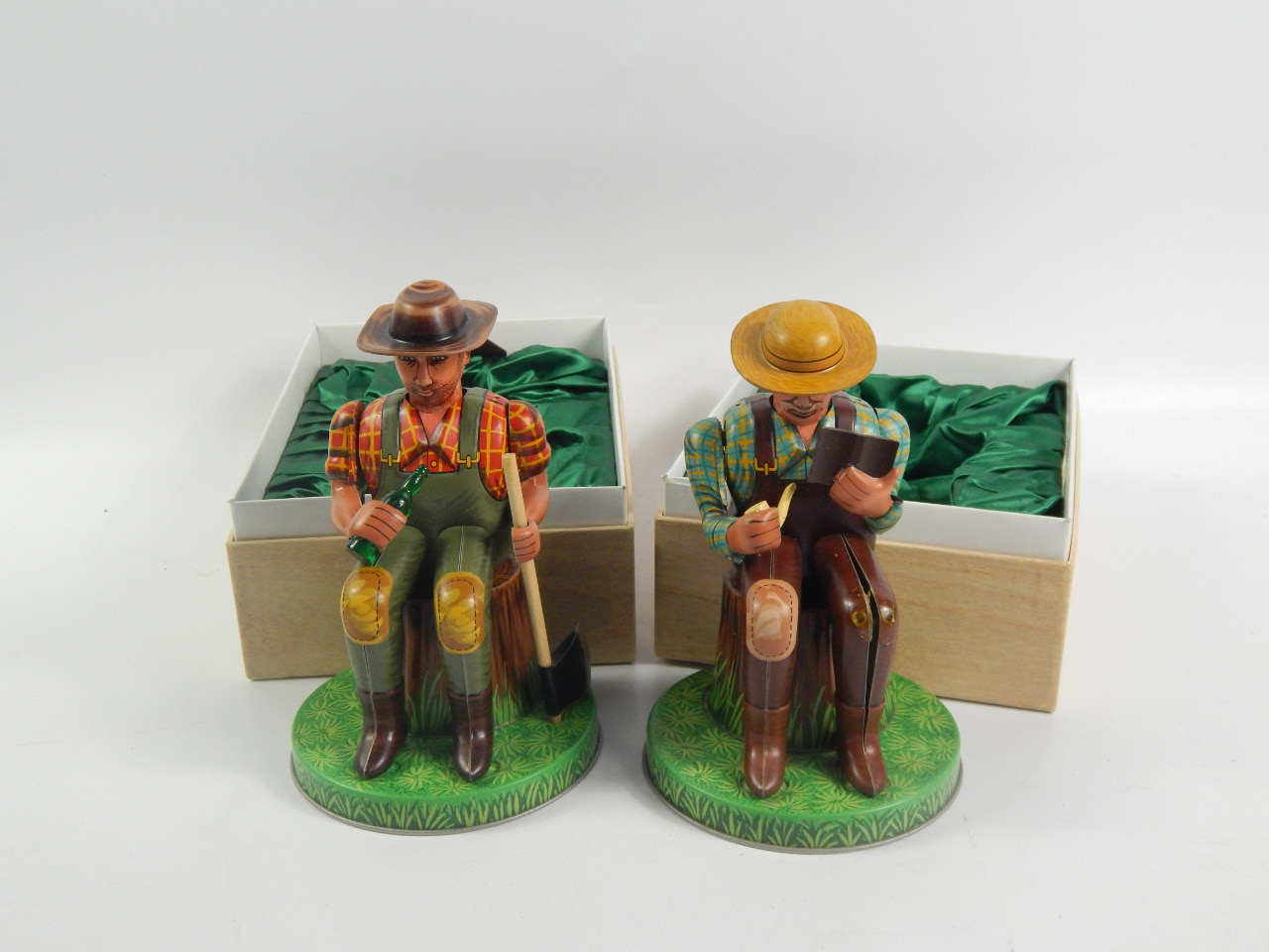 Appraisal: Two Alps antique collection Japanese figures of seated gentlemen drinking