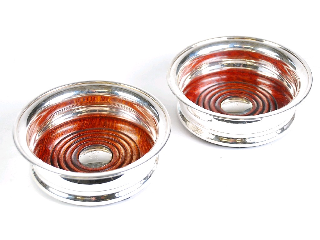 Appraisal: PAIR OF MODERN PLAIN SILVER WINE COASTERS by Barker Ellis