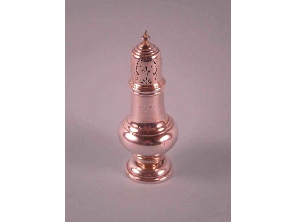 Appraisal: A silver sugar caster with a turned finial and domed