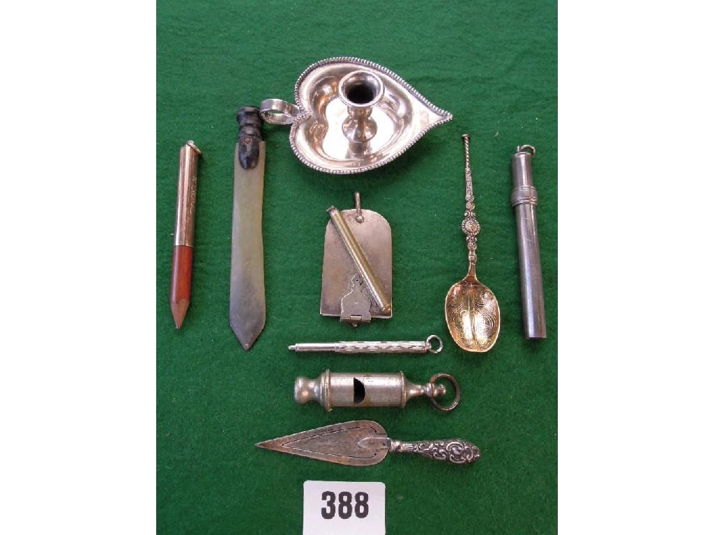 Appraisal: A silver hearth shaped chamber stick military whistle silver trowel