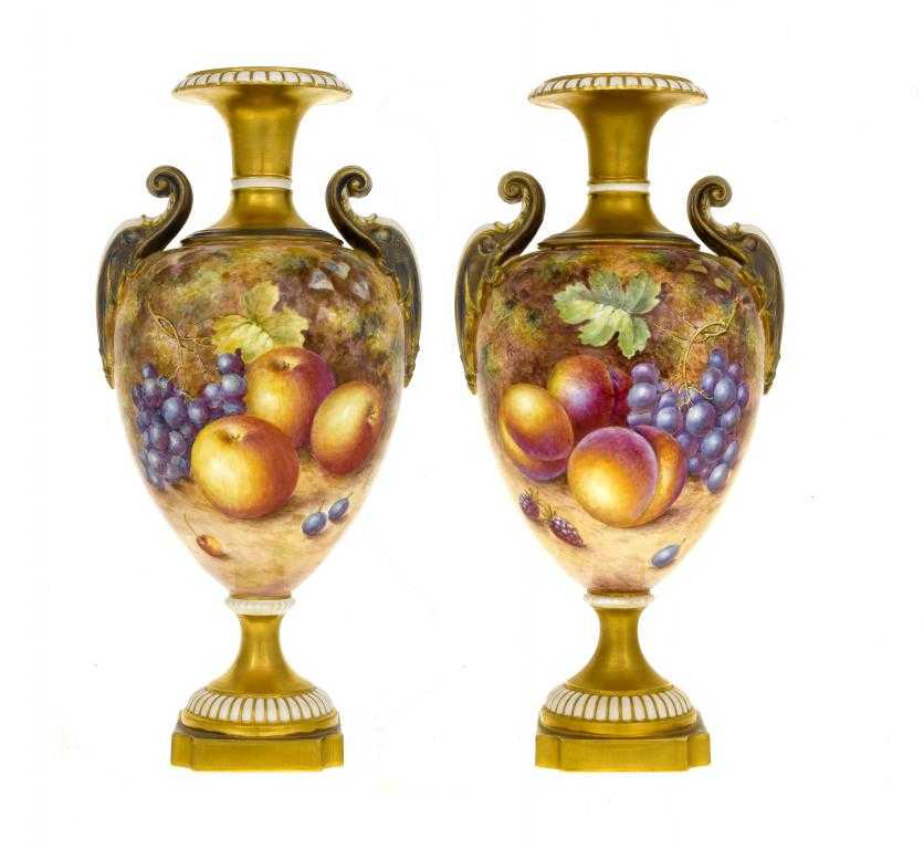 Appraisal: A PAIR OF ROYAL WORCESTER VASES of shield shape painted