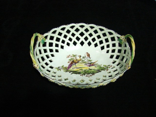 Appraisal: A th century English porcelain basket centrally painted with Asiatic