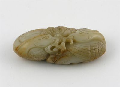 Appraisal: A Chinese jade carving of two phoenix the brown flecked