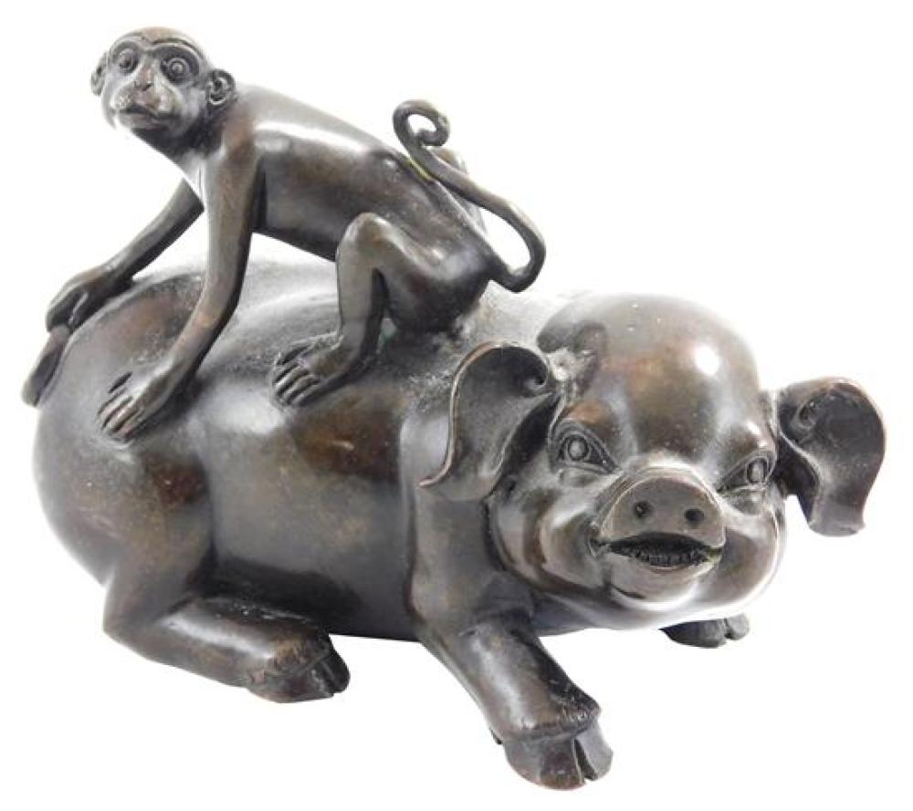 Appraisal: ASIAN Japanese bronze monkey on pig hollow interior Japanese characters