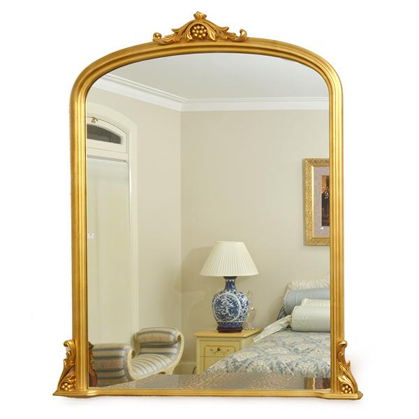 Appraisal: A ROUNDED RECTANGULAR GILT WOOD FRAMED OVER MANTEL MIRROR WITH