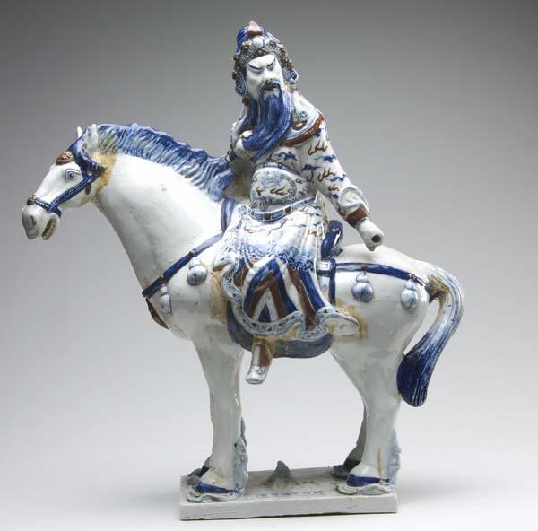 Appraisal: CHINESE PORCELAIN Figural group of a warrior on horseback in