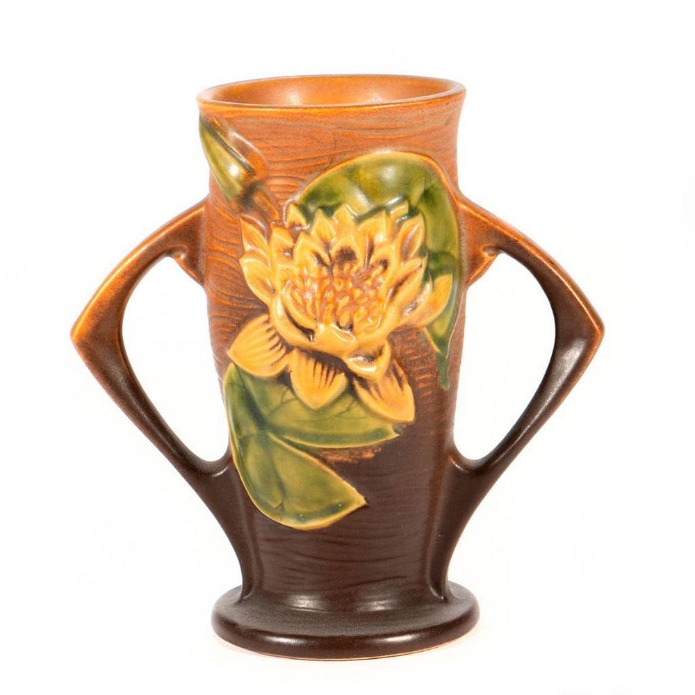 Appraisal: Roseville Pottery Vase Decorated with raised sunflowers Circa raised mark