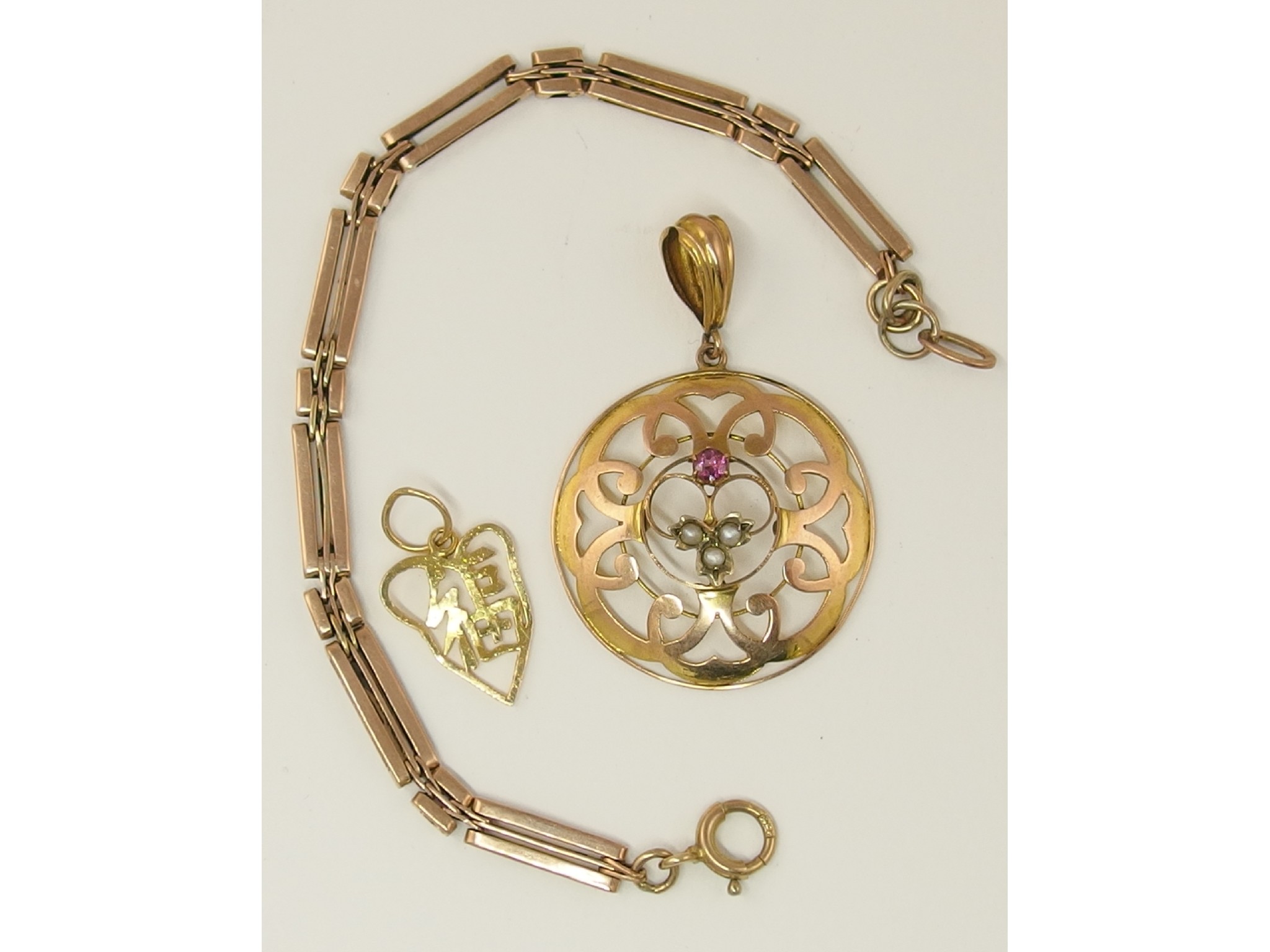 Appraisal: A ct pink gem and seed pearl Edwardian pendant a