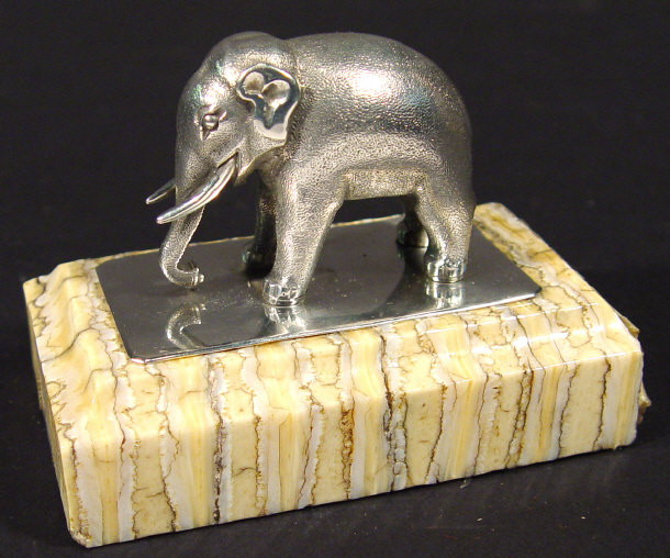 Appraisal: Indian silver elephant mounted on a rectangular piece of elephants