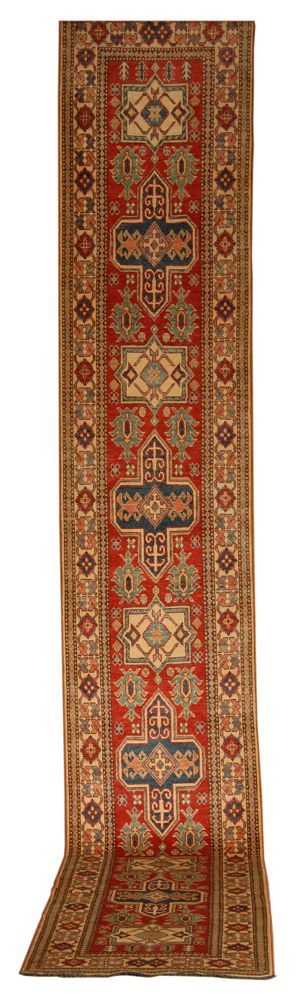 Appraisal: ORIENTAL RUG KAZAK DESIGN RUNNER ' x ' Nine geometric