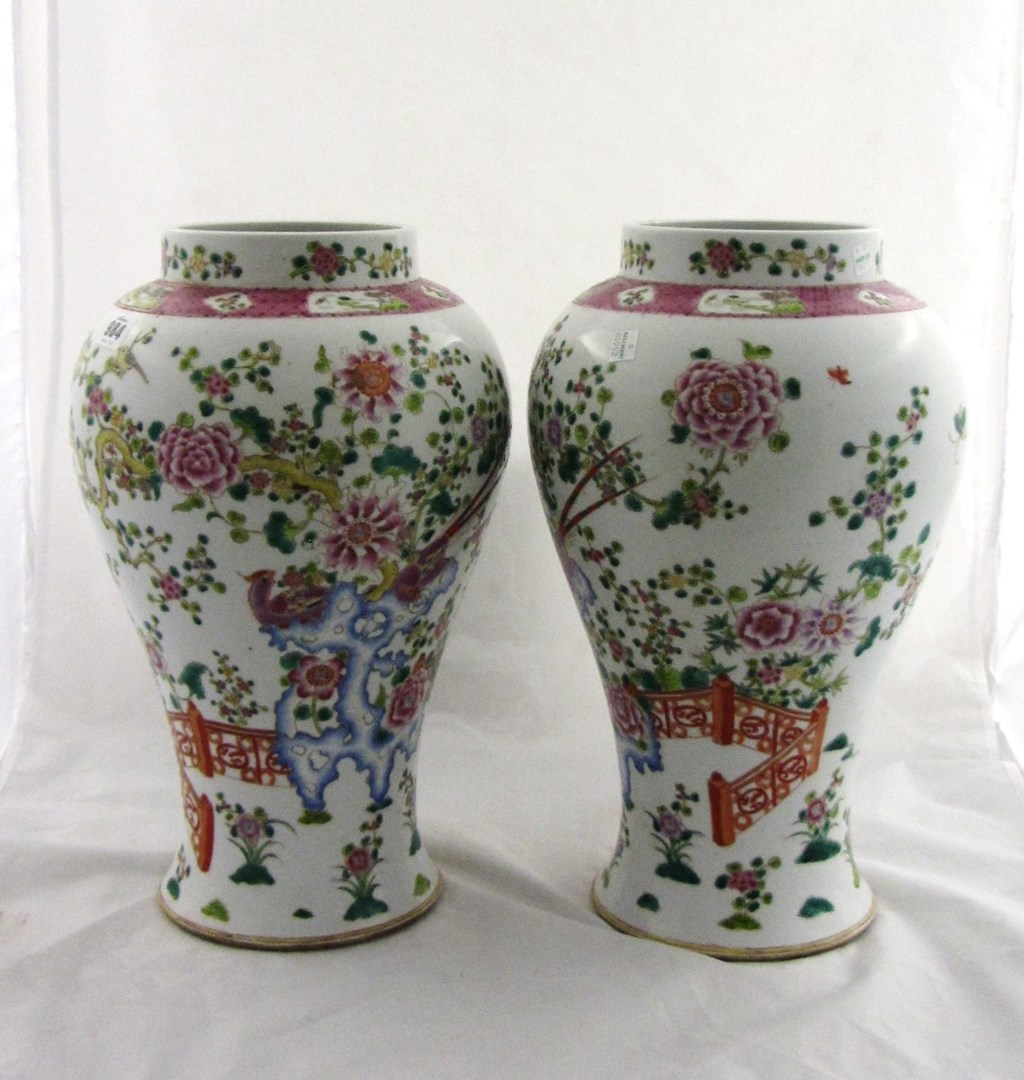 Appraisal: A pair of tall Chinese famille-rose vases th century painted